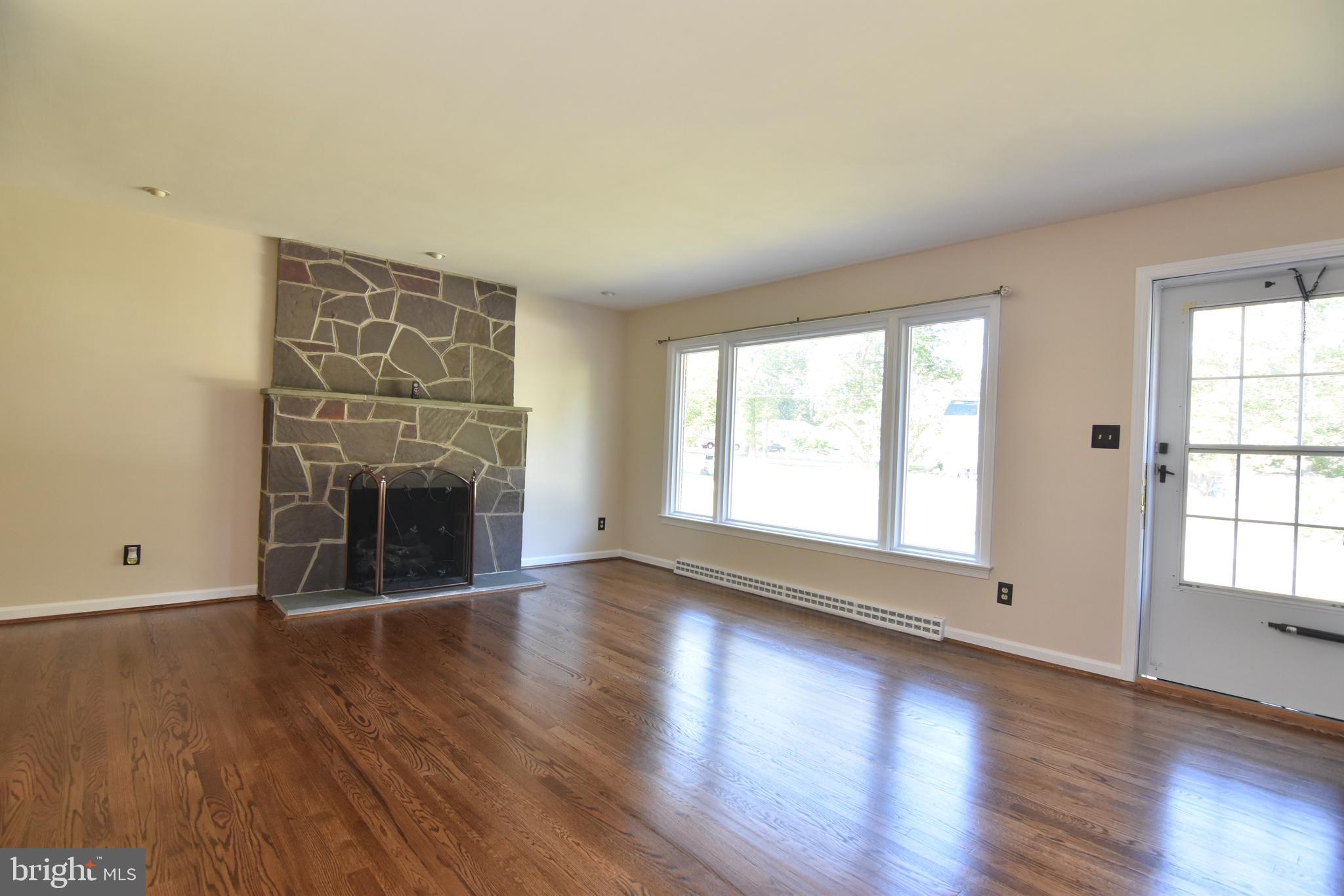 Living room with stone fireplace