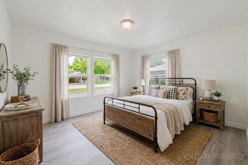 524 West Roberts Street Gorman, TX 76454 - Photo 15 of 35 a bedroom with a bed and a window