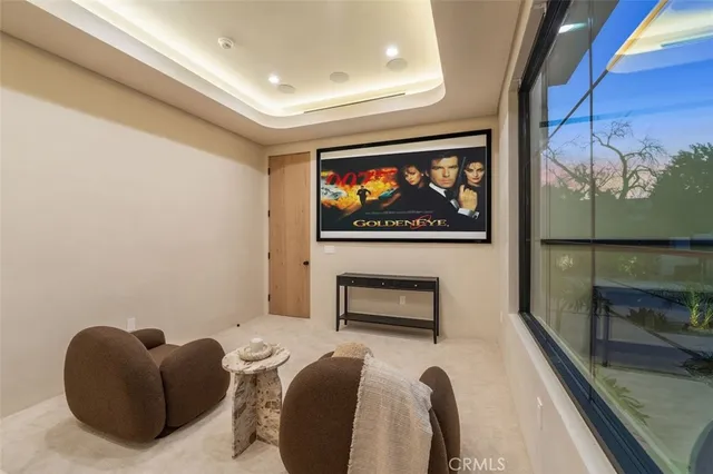 a view of a patio with a table and chairs