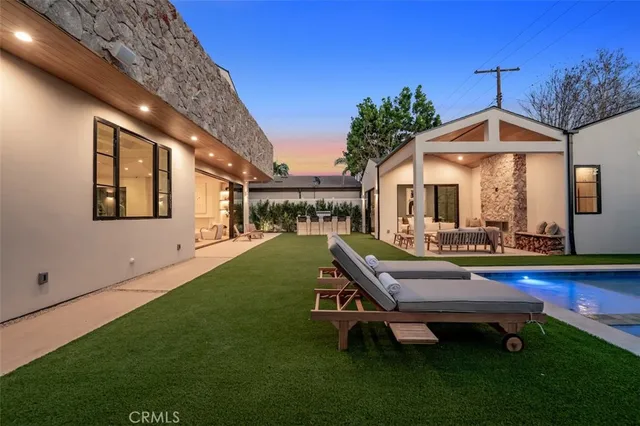 a spacious bathroom with a tub sink and mirror