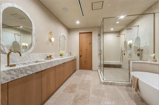 a bathroom with a toilet a sink a mirror and vanity