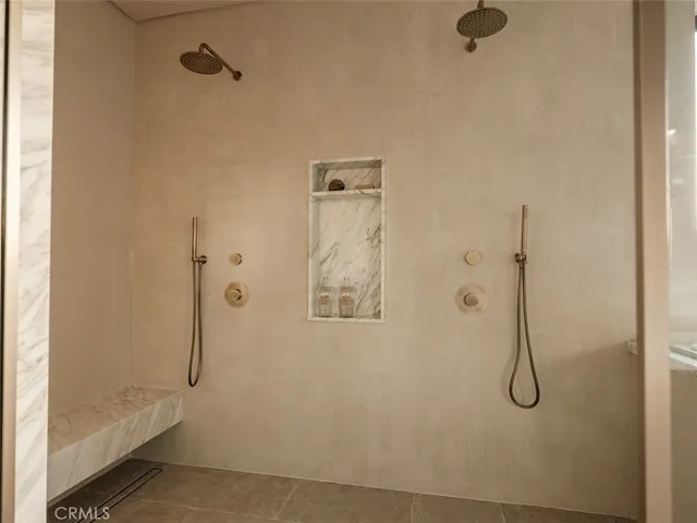 a bedroom with a bed and painting on the wall