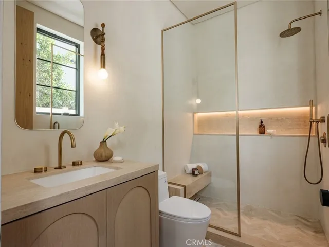 a living room with furniture and a lamp