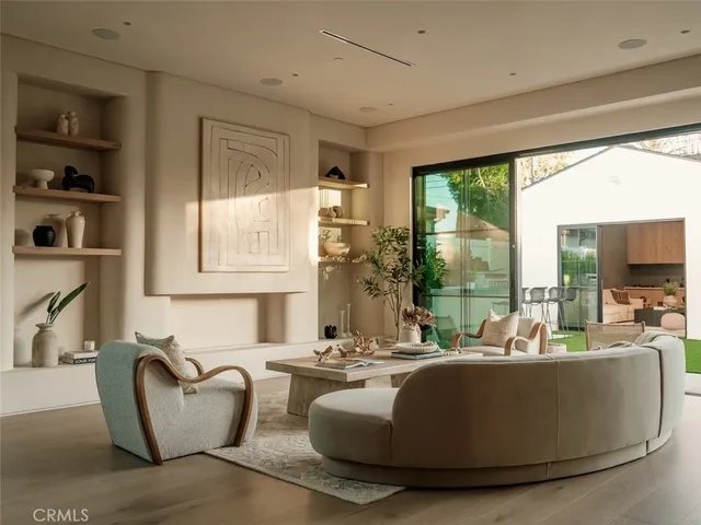 a dining room with furniture and wooden floor