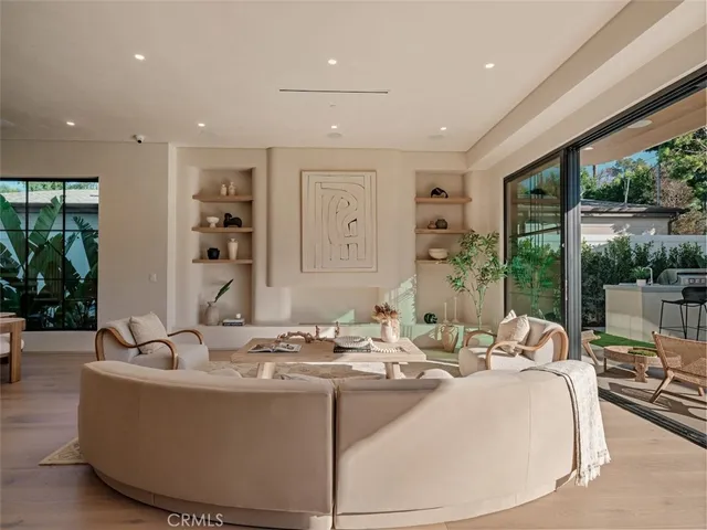 a view of a dining room with furniture wooden floor and chandelier