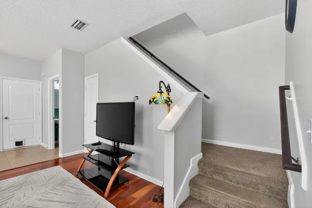 a kitchen with stainless steel appliances granite countertop a kitchen island a stove a table and chairs