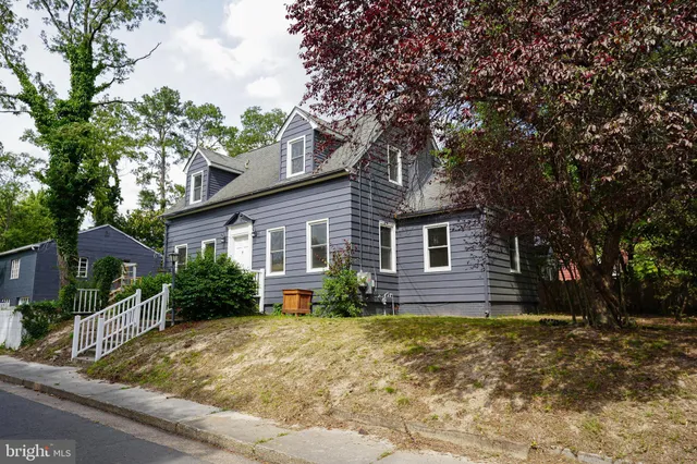 a backyard of a house with oven and brick wall