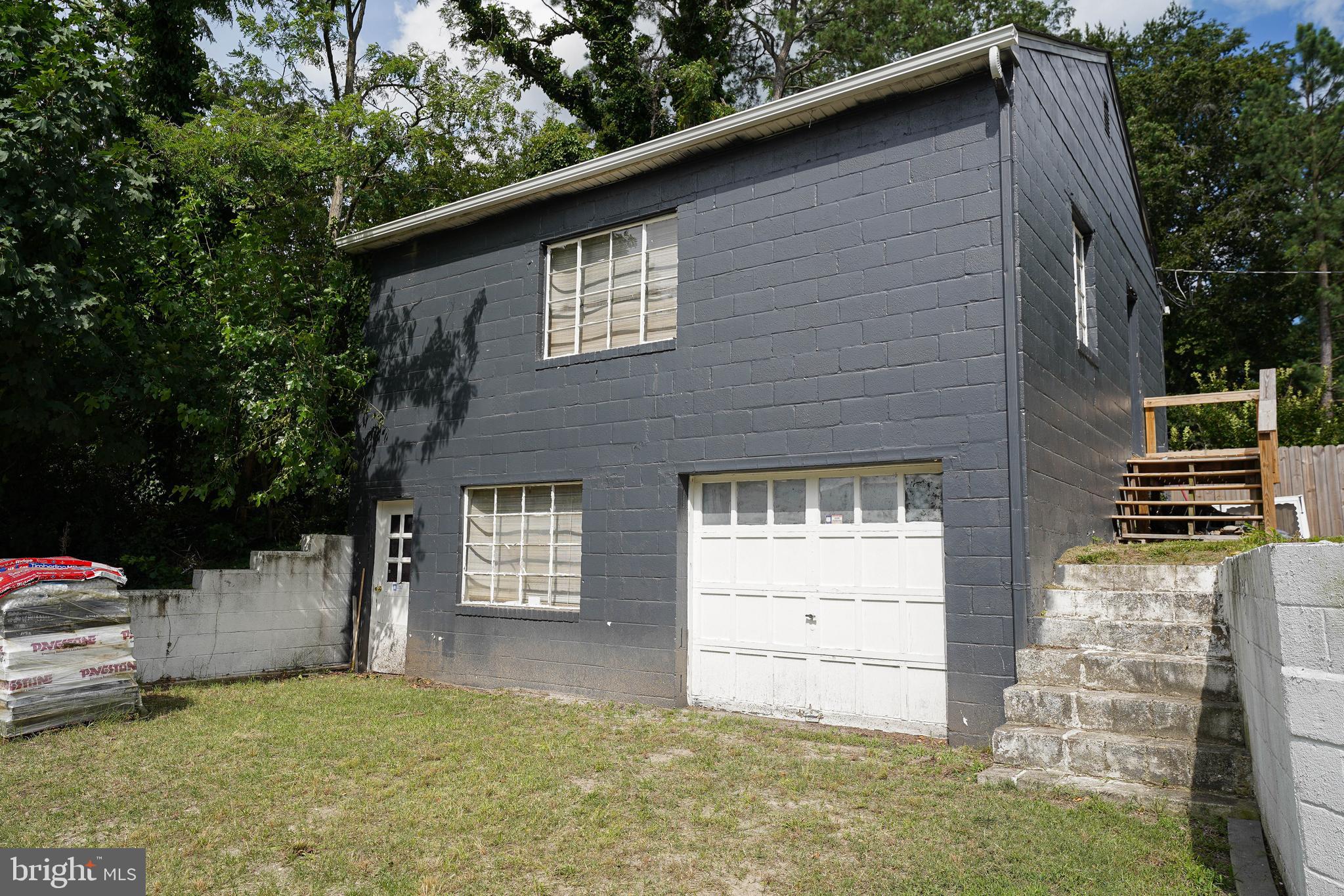 815 Federal Street Salisbury, MD 21801 - Photo 2 of 43 a backyard of a house with oven and brick wall