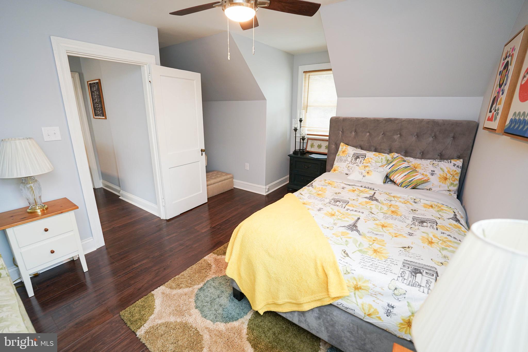 815 Federal Street Salisbury, MD 21801 - Photo 25 of 43 a bedroom with a bed and wooden floor