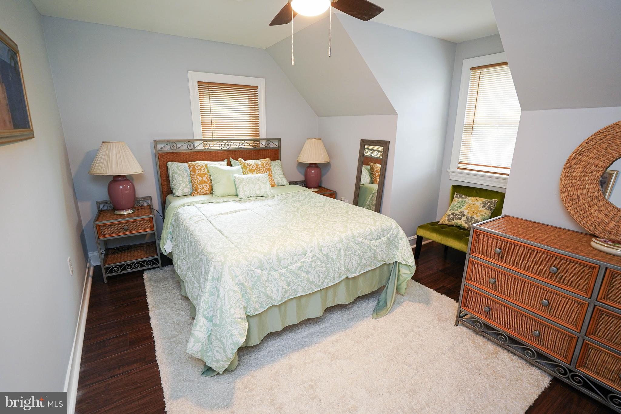 815 Federal Street Salisbury, MD 21801 - Photo 29 of 43 a bedroom with a bed and a chandelier