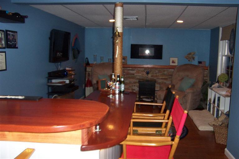 16 Gold Leaf Lane, Unit 16 Mashpee, MA 02649 - Photo 23 of 29 a living room with furniture and a flat screen tv