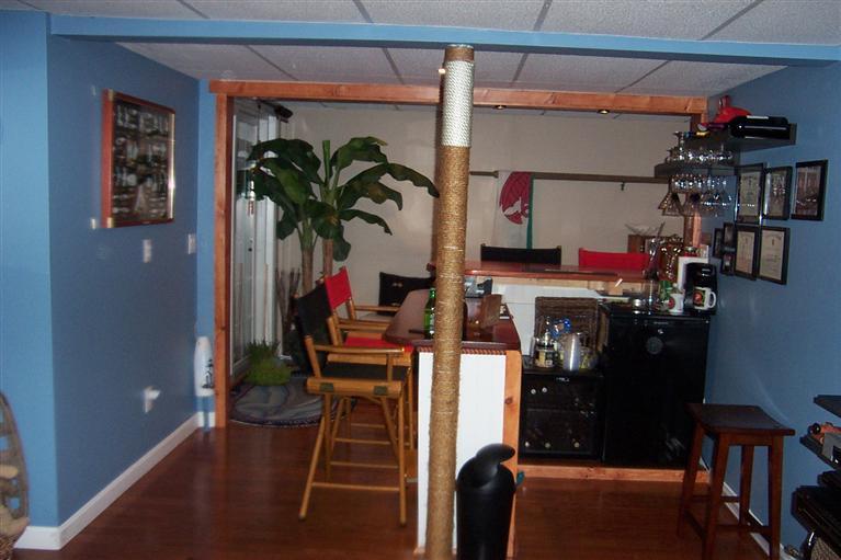 16 Gold Leaf Lane, Unit 16 Mashpee, MA 02649 - Photo 24 of 29 a room with storage and a potted plant