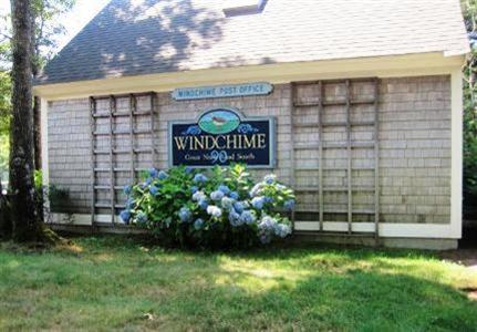 16 Gold Leaf Lane, Unit 16 Mashpee, MA 02649 - Photo 7 of 29 a sign that is sitting in front of a brick house