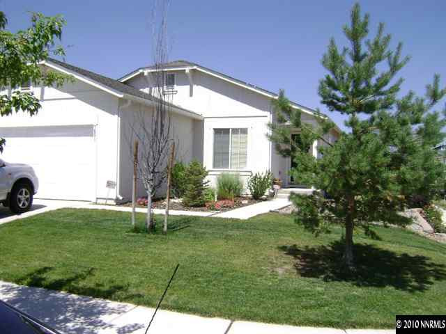 7651 Corso Street Reno, NV 89506 - Photo 1 of 6 a front view of a house with garden