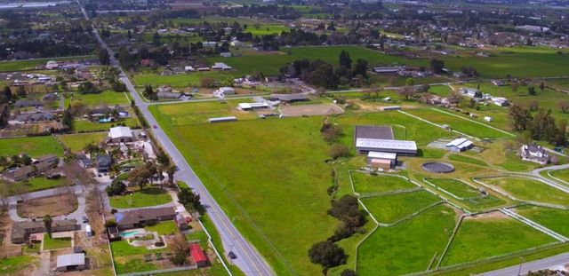 an aerial view of a pool yard patio and outdoor seating