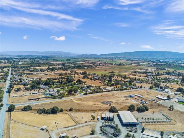 an aerial view of a swimming pool and mountain view