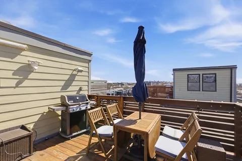 a view of a balcony with furniture