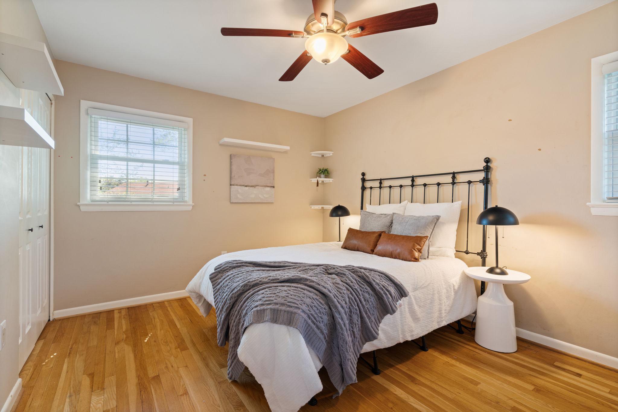 7600 Kingsbury Road Alexandria, VA 22315 - Photo 12 of 31 a bedroom with a bed and wooden floor