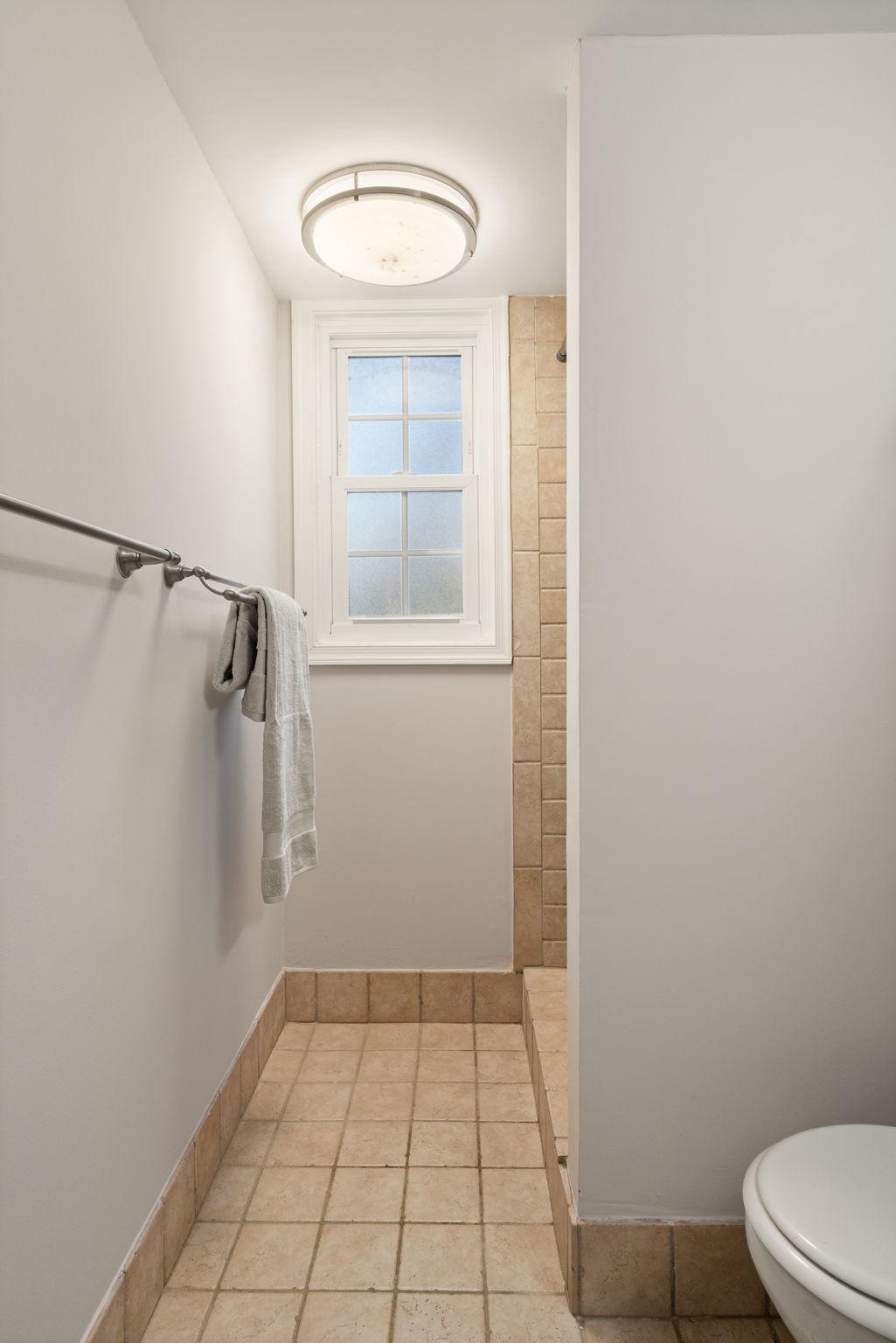 7600 Kingsbury Road Alexandria, VA 22315 - Photo 18 of 29 Basement bathroom with tiled, walk-in shower