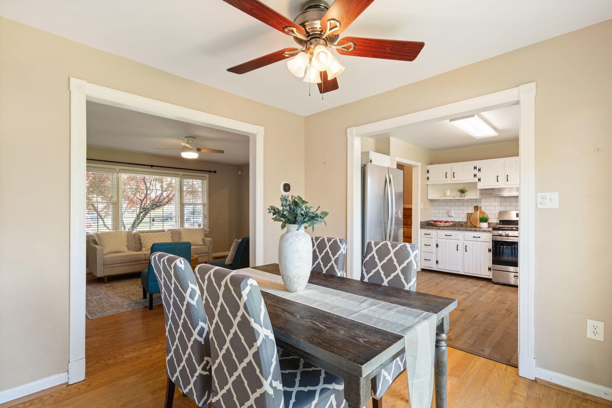 7600 Kingsbury Road Alexandria, VA 22315 - Photo 7 of 31 a view of a dining room with furniture and a chandelier