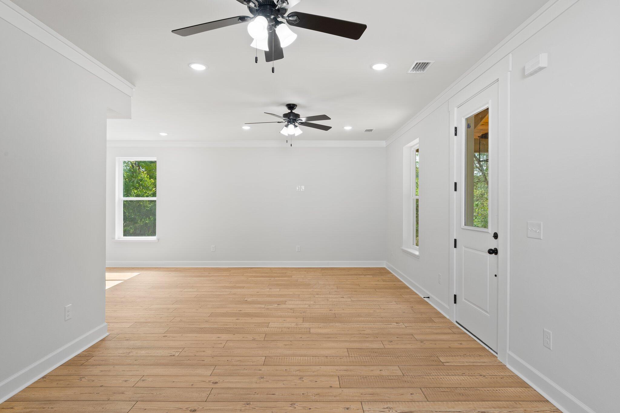 45 Laurel Oak Lane Santa Rosa Beach, FL 32459 - Photo 11 of 30 an empty room with fan and windows