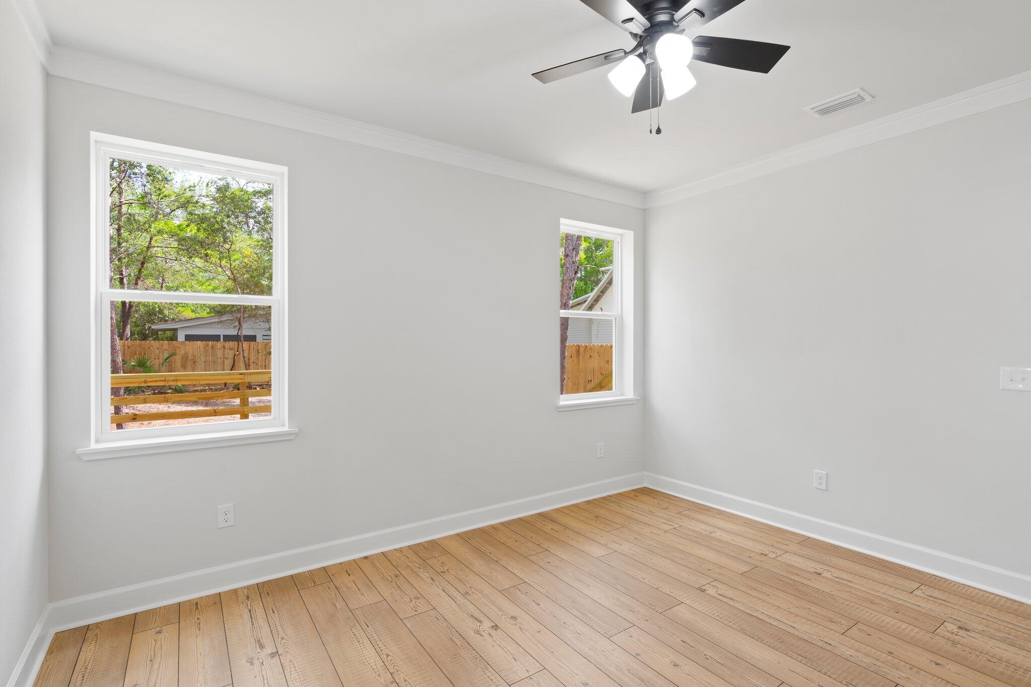45 Laurel Oak Lane Santa Rosa Beach, FL 32459 - Photo 24 of 30 a view of an empty room with wooden floor and a window