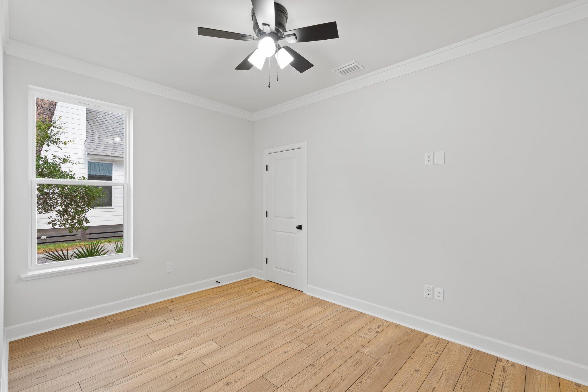45 Laurel Oak Lane Santa Rosa Beach, FL 32459 - Photo 28 of 30 wooden floor in an empty room with a window