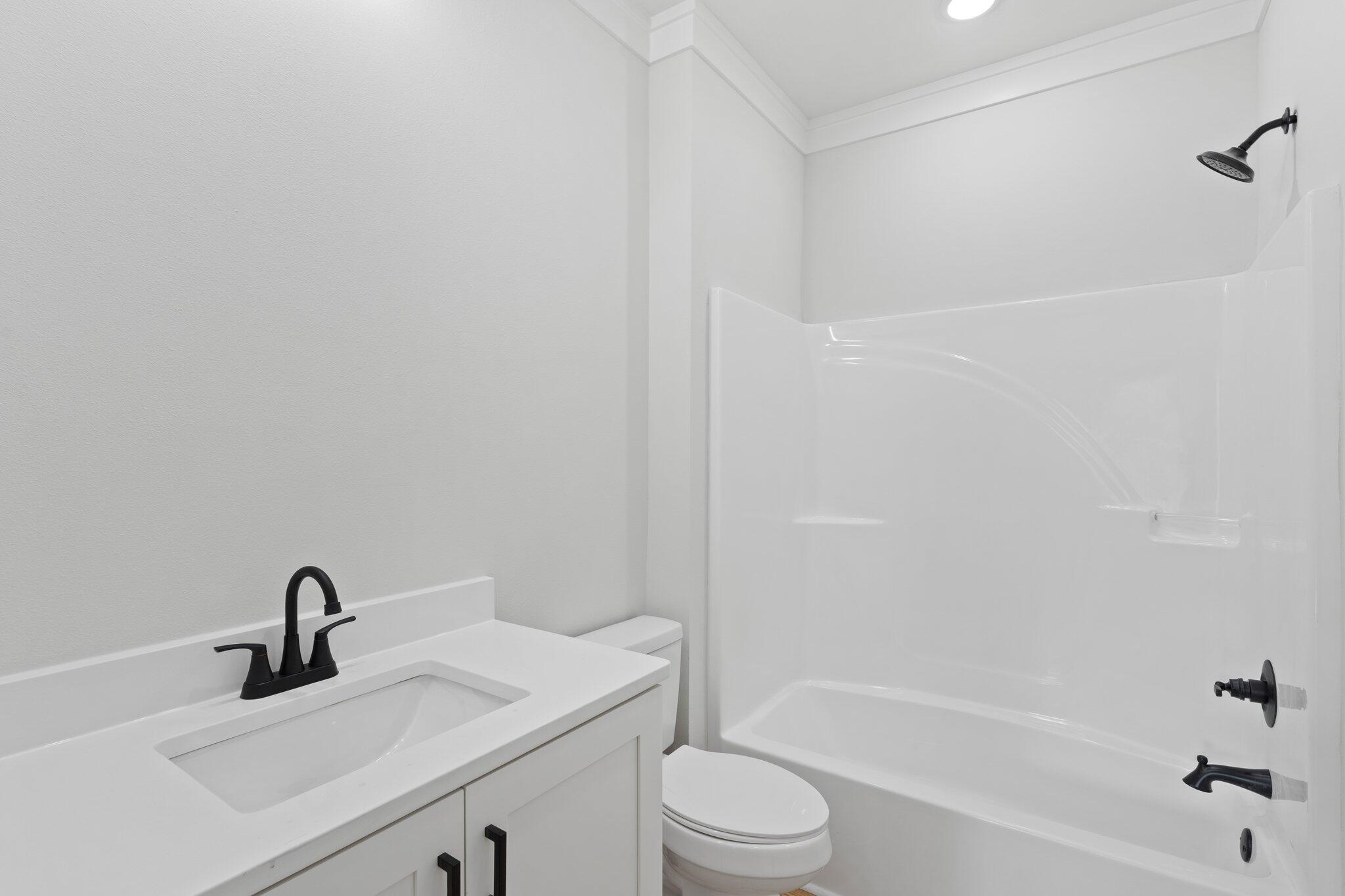 45 Laurel Oak Lane Santa Rosa Beach, FL 32459 - Photo 30 of 30 a bathroom with a granite countertop sink toilet and shower