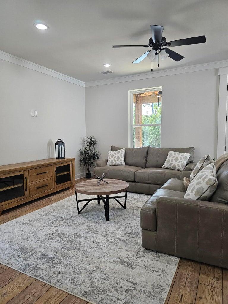 45 Laurel Oak Lane Santa Rosa Beach, FL 32459 - Photo 7 of 30 a living room with furniture and a wooden floor