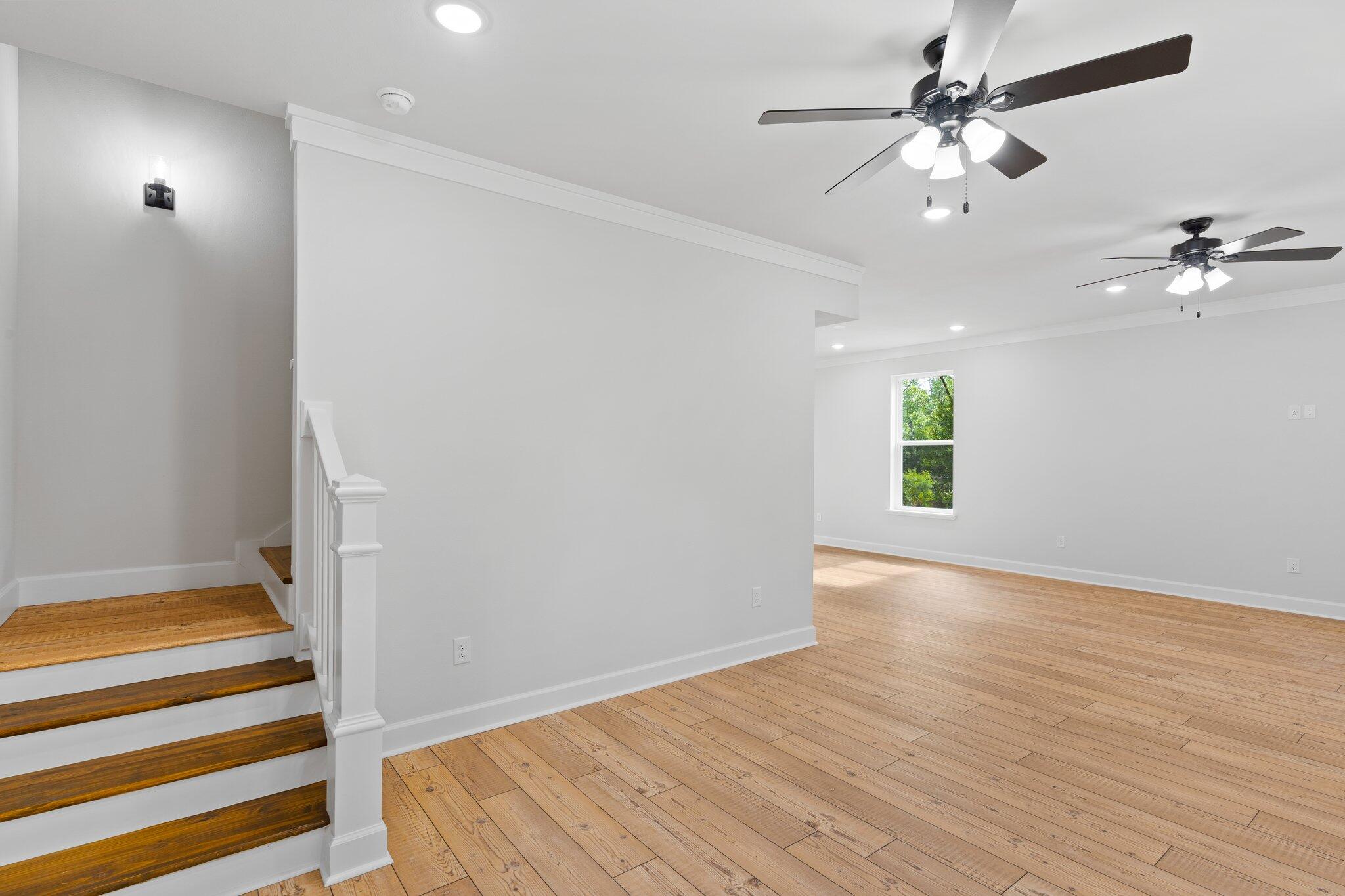 45 Laurel Oak Lane Santa Rosa Beach, FL 32459 - Photo 10 of 30 wooden floor in an empty room with a window