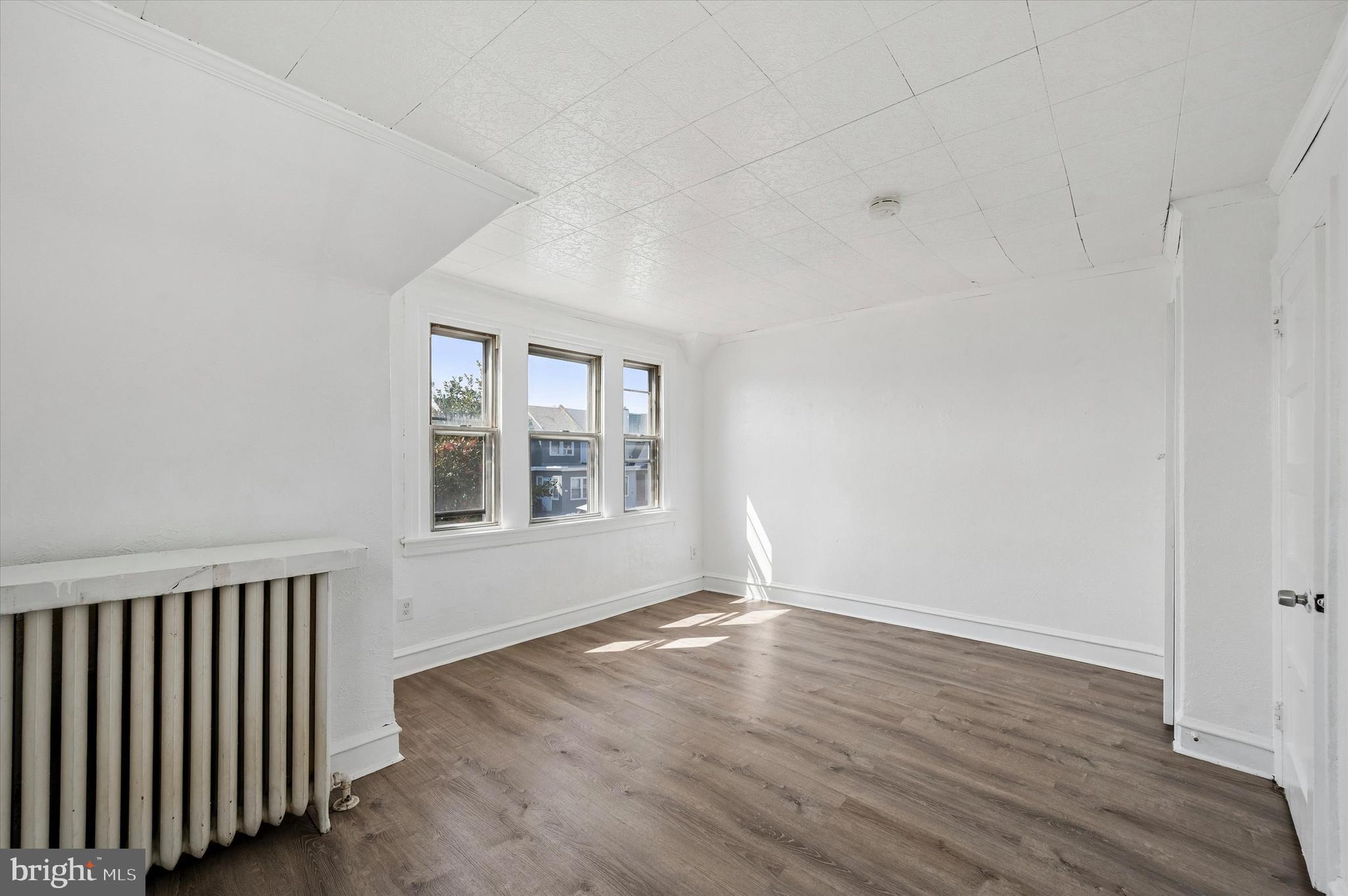 59 Houston Road Lansdowne, PA 19050 - Photo 22 of 24 wooden floor in an empty room with a window