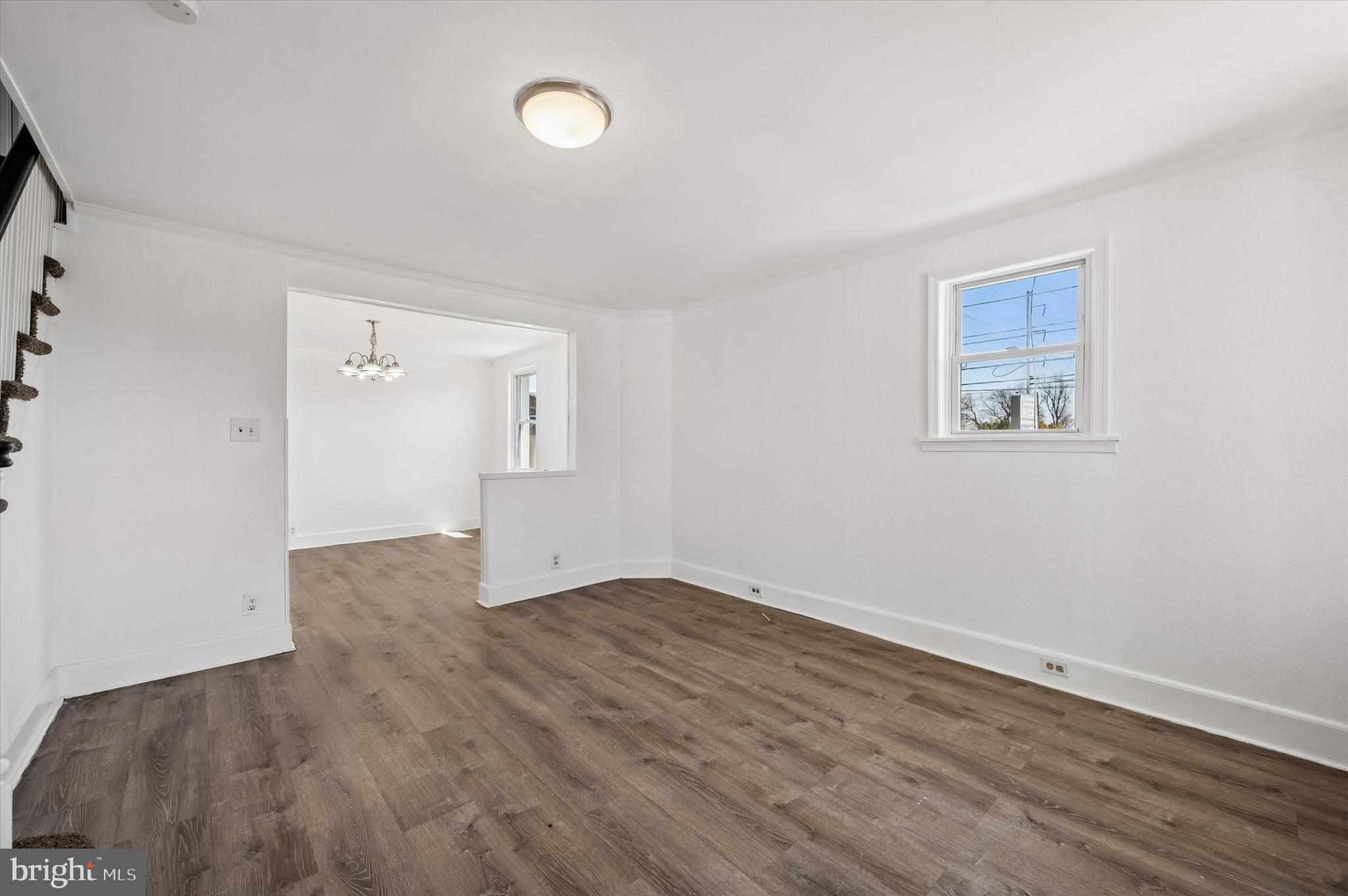 59 Houston Road Lansdowne, PA 19050 - Photo 4 of 24 an empty room with wooden floor and windows