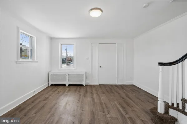 a view of a room with cabinet and windows