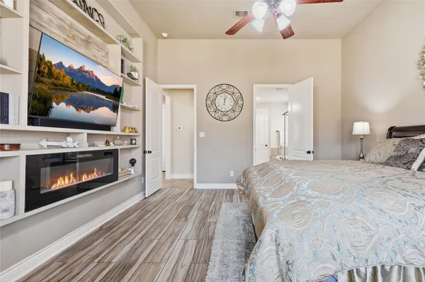 a bedroom with a bed and a desk