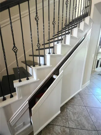 a view of a livingroom with furniture and staircase