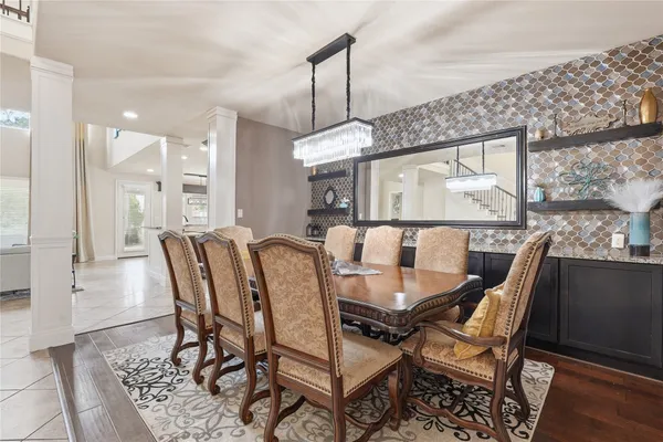 a living room with furniture and kitchen view