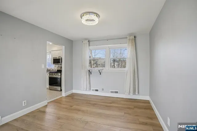 a view of a livingroom with wooden floor