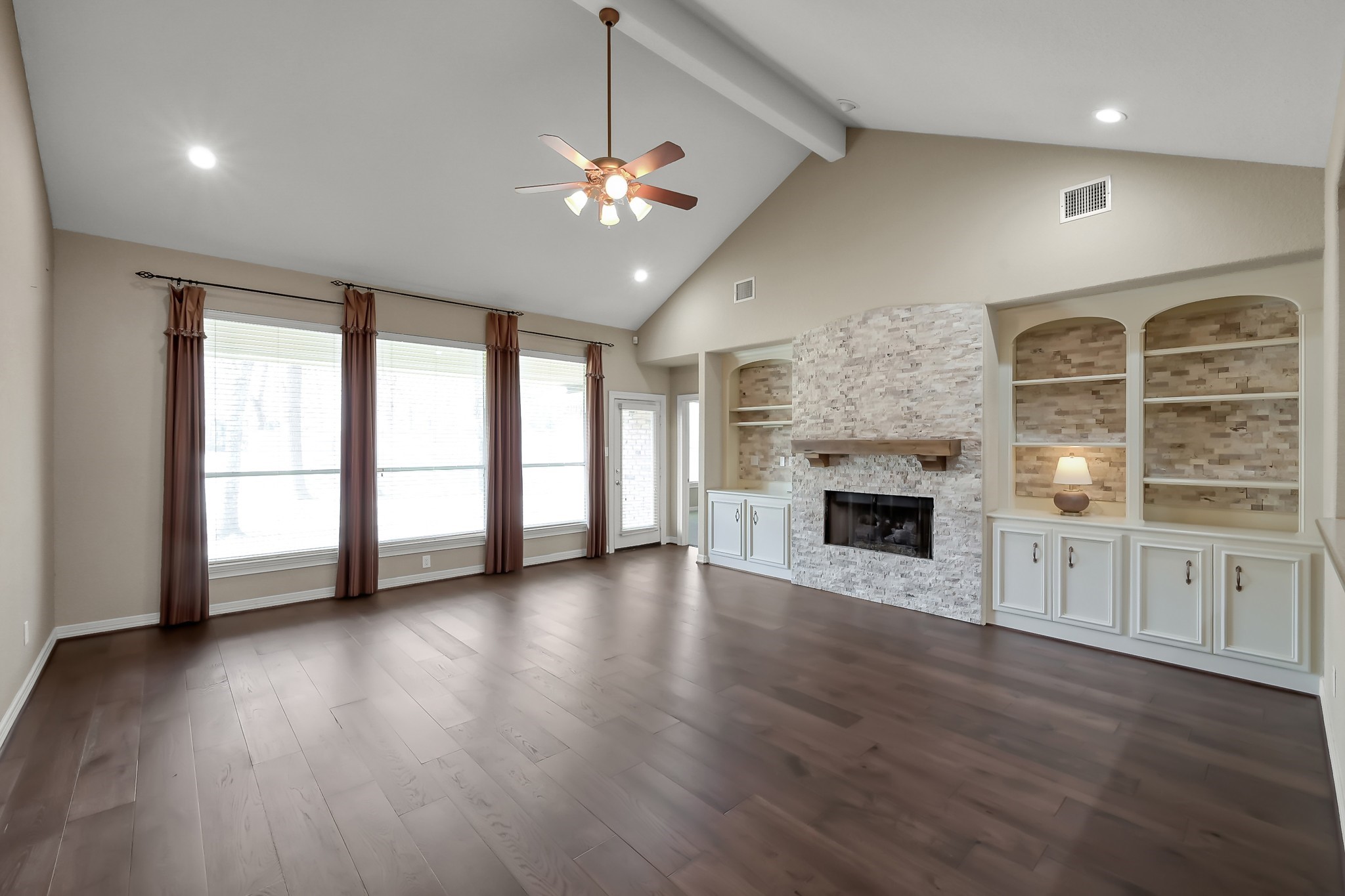 25536 Richards Road Spring, TX 77386 - Photo 14 of 44 Huge 20x20 Living Room complete with a Stone Fireplace and Built-ins shelving!