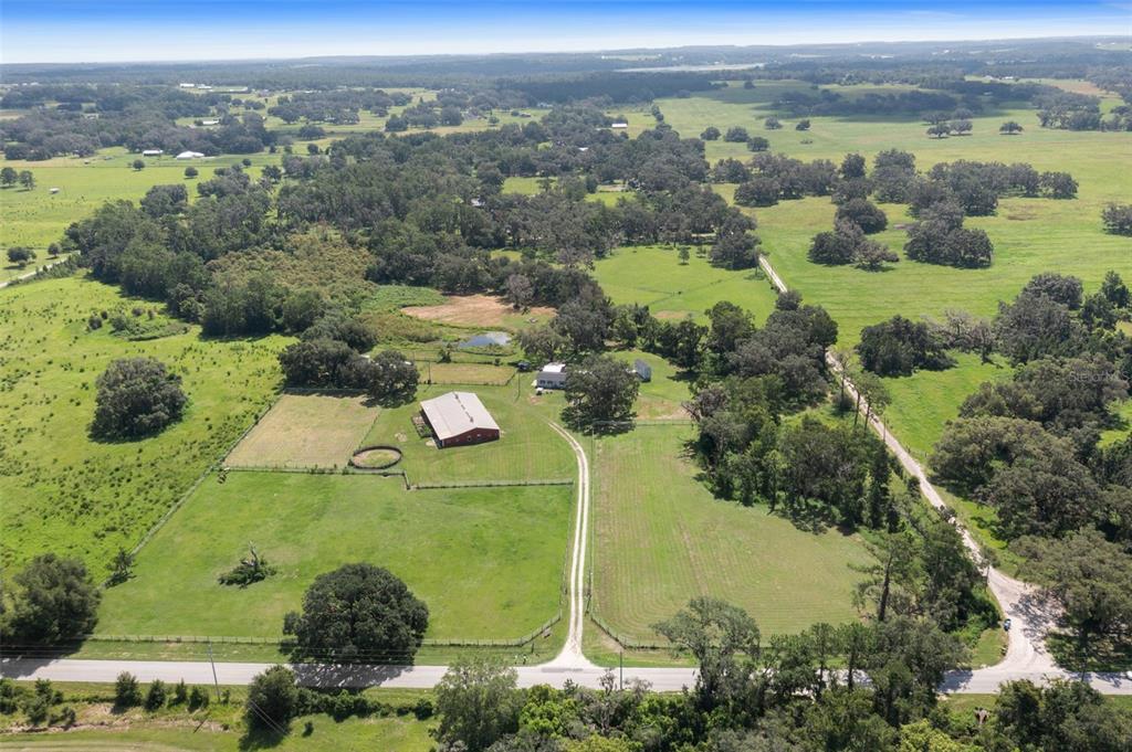 88 Culbreath Road Brooksville, FL 34602 - Photo 1 of 1 an aerial view of a house with a lake view