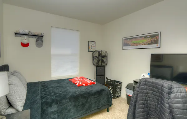 a bedroom with furniture and a bed