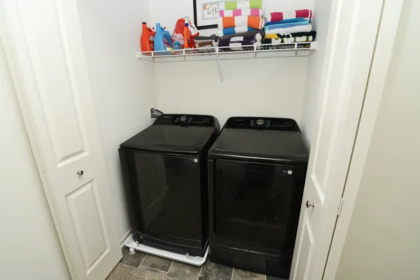 a utility room with dryer and washer