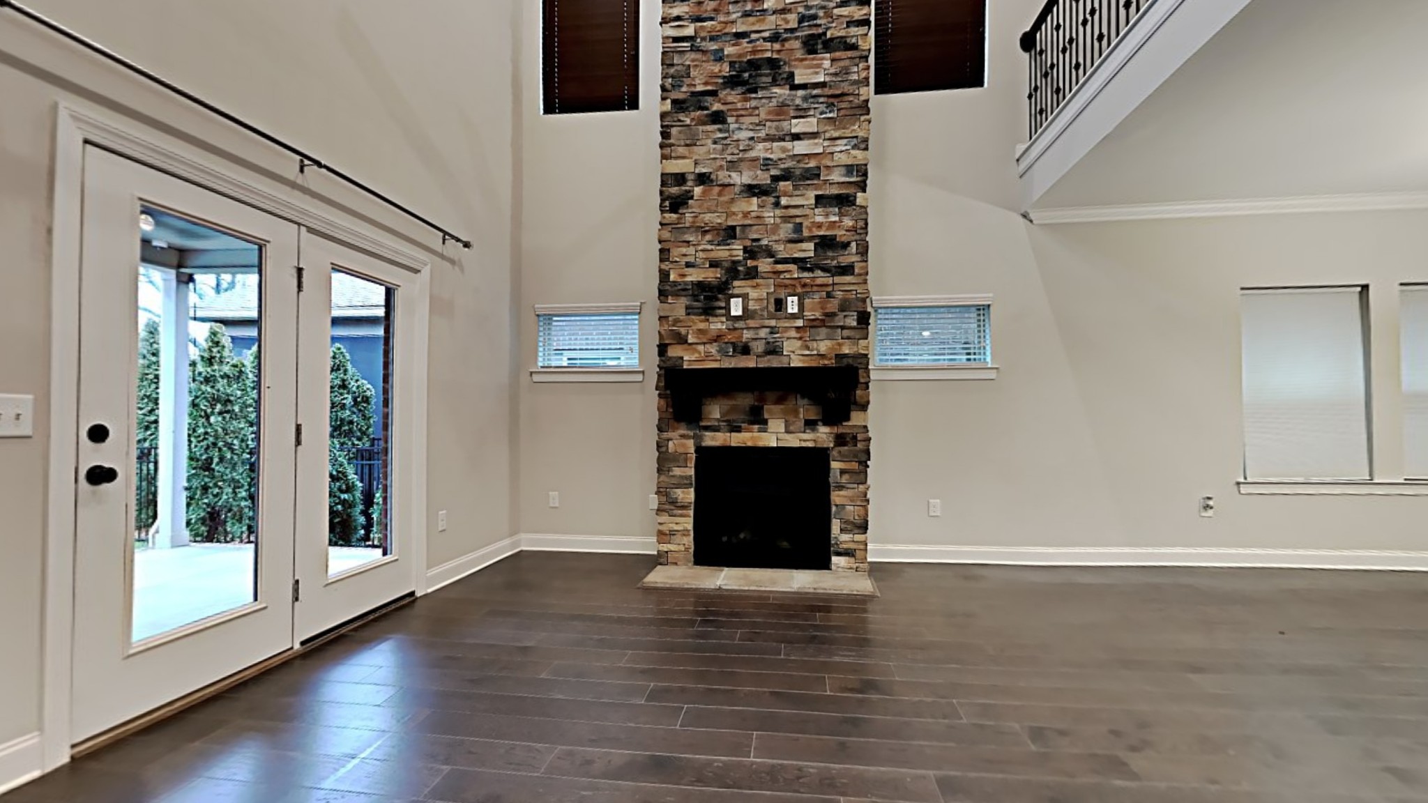 1007 Fenner Lane Gallatin, TN 37066 - Photo 4 of 18 an empty room with wooden floor fireplace and windows