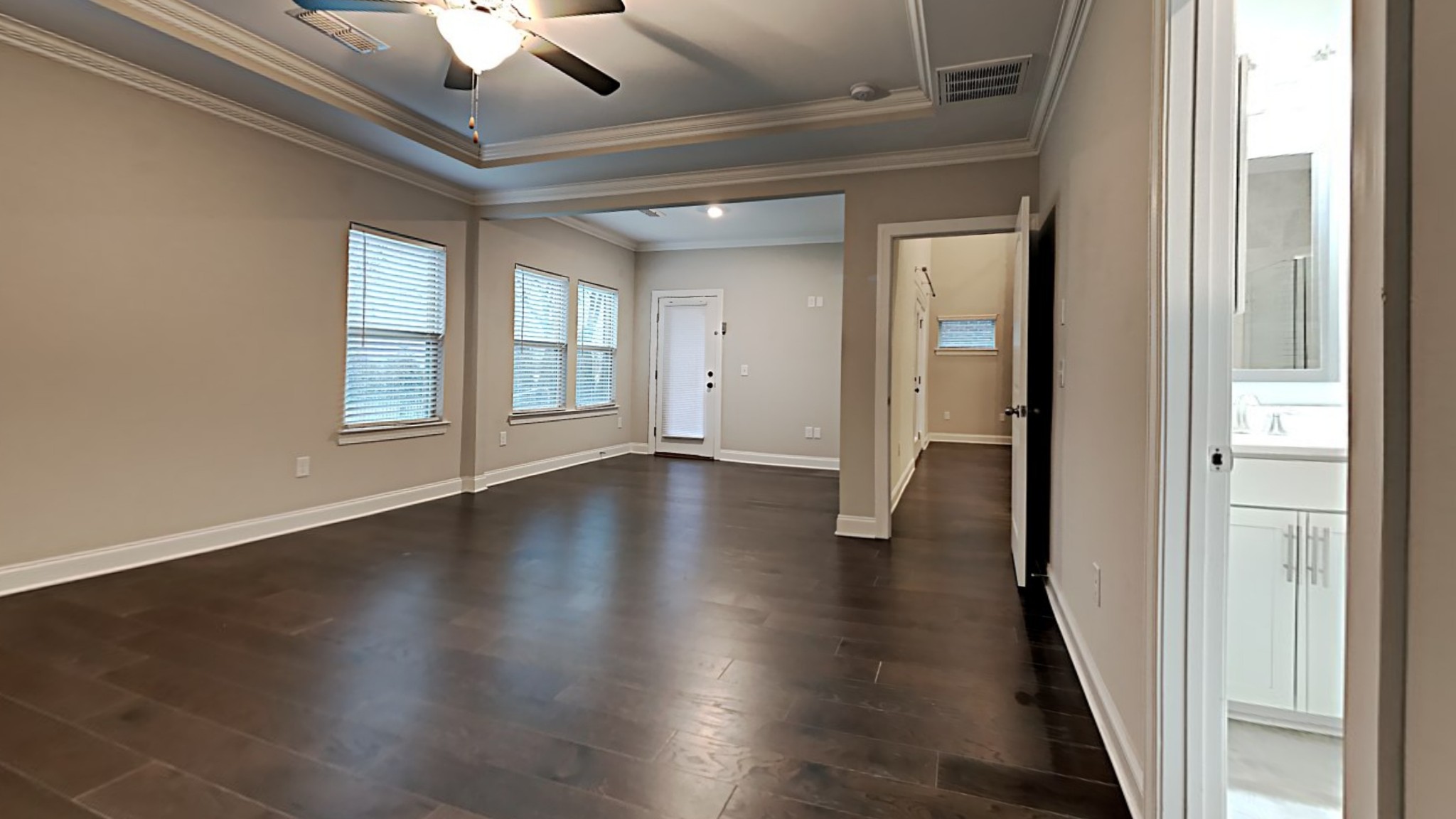 1007 Fenner Lane Gallatin, TN 37066 - Photo 7 of 18 a view of an empty room with wooden floor and a window