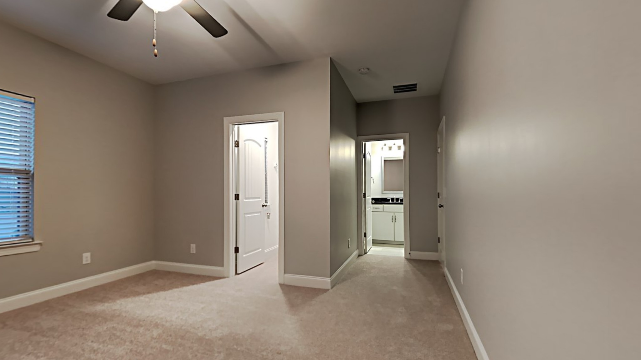 1007 Fenner Lane Gallatin, TN 37066 - Photo 10 of 18 an empty room with chandelier fan and windows