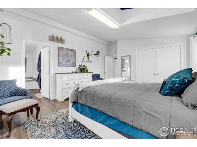 a bedroom with a bed and a couch