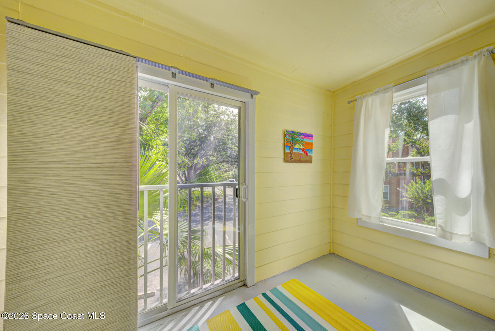 225 South Tropical Trail, Unit 605 Merritt Island, FL 32952 - Photo 16 of 36 balcony with screen door
