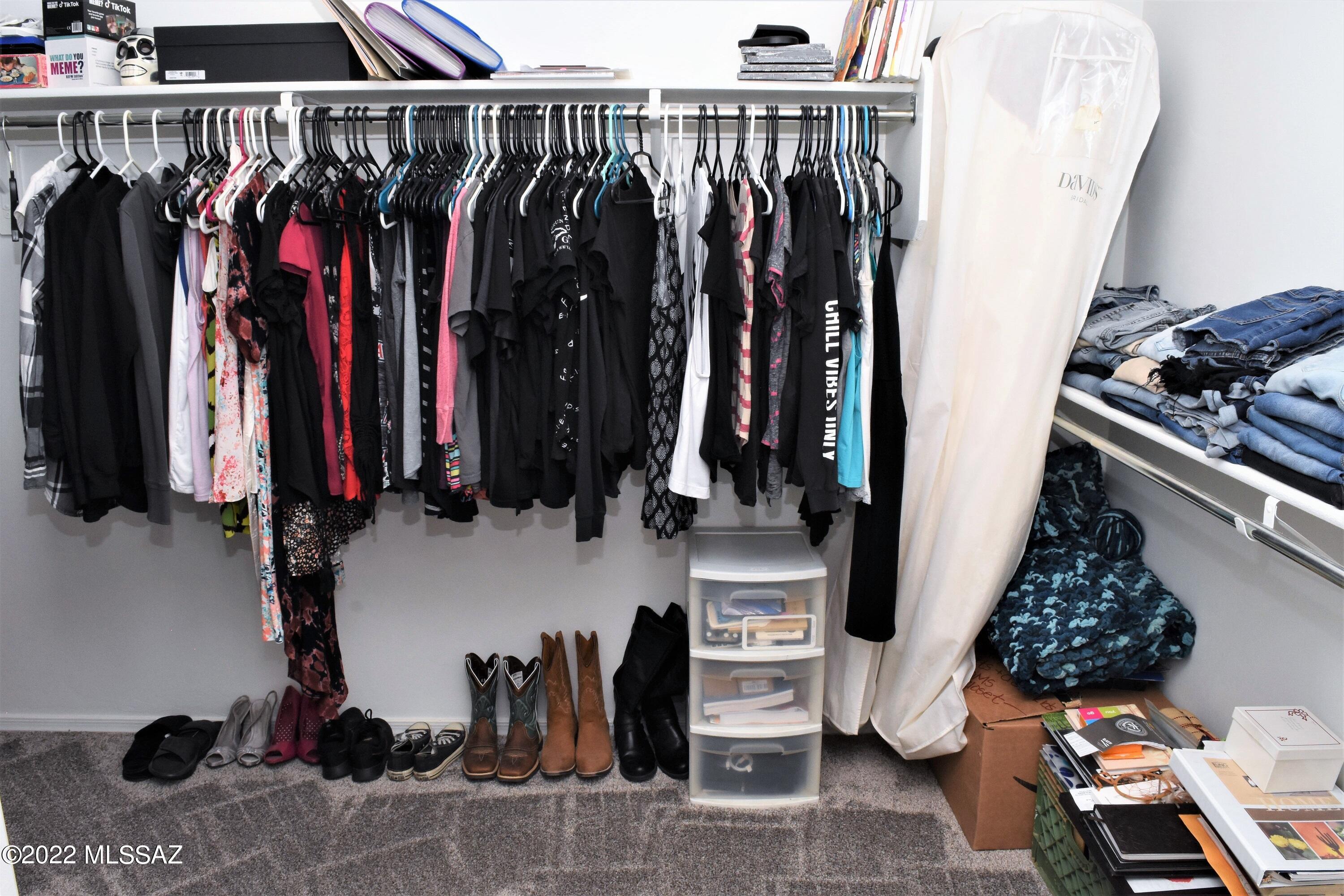 21295 East Treasure Road Red Rock, AZ 85145 - Photo 17 of 34 a view of walk in closet with clothes and shoes