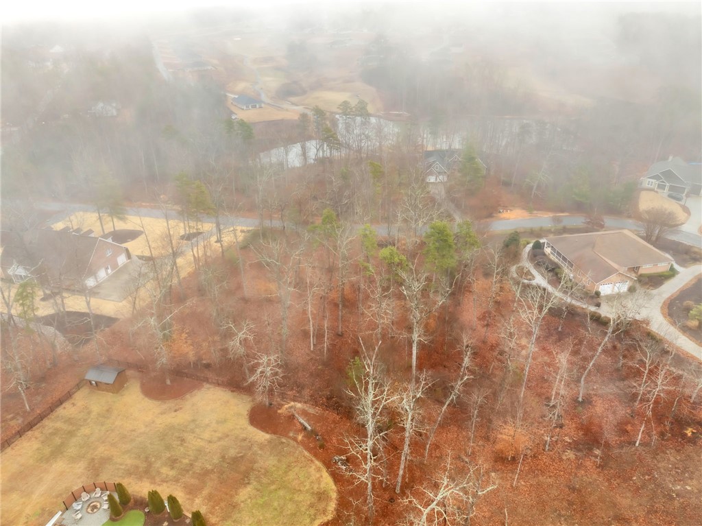 508 16th Circle Walhalla, SC 29691 - Photo 4 of 12 Panoramic views of this expansive property featuring a serene lake and lush wooded surroundings.