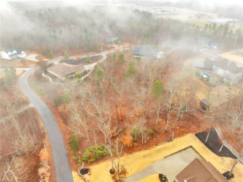 508 16th Circle Walhalla, SC 29691 - Photo 7 of 12 An aerial view reveals an expansive lot amidst natural woodlands, offering a private setting.