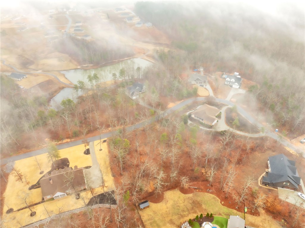 508 16th Circle Walhalla, SC 29691 - Photo 9 of 12 This elevated view captures the tranquil community nestled amidst natural landscapes and a serene lake.